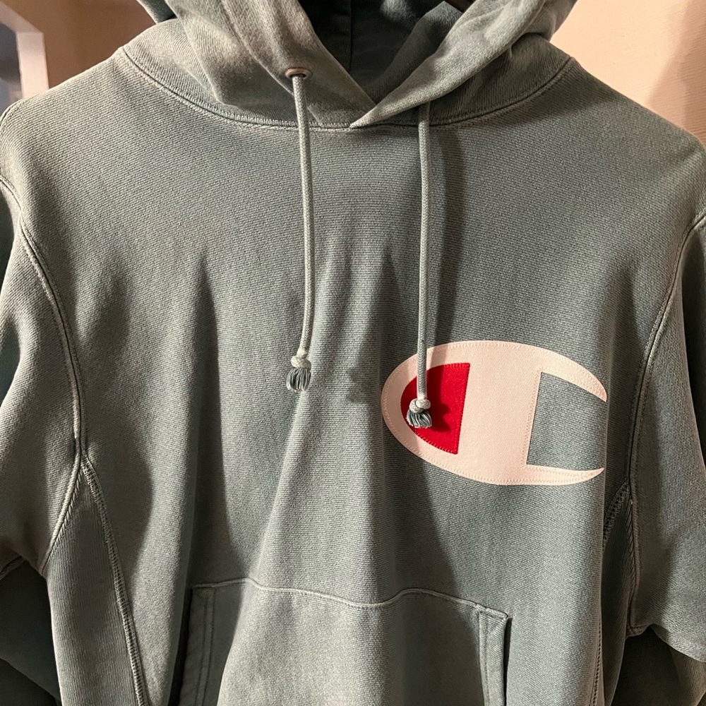 Champion hoodie in size s, washed aqua/teal with chest and sleeve logo